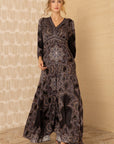 Elegante maxidress in een zwarte print uit de herfstcollectie van Hale Bob.