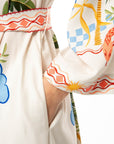 124130310 IVI Collection Sunshine kaftan jurk met detail van de steekzak.